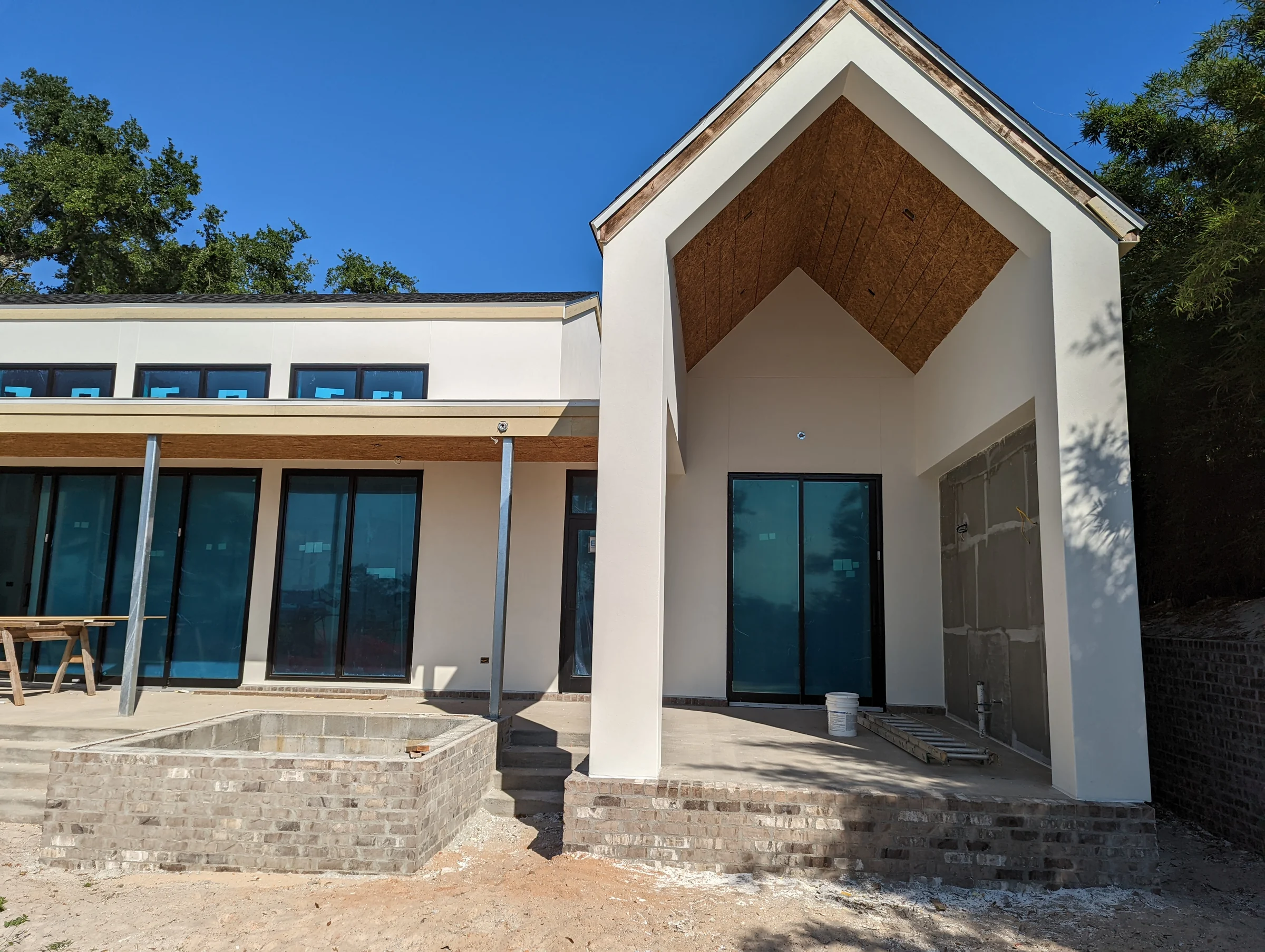 Angular light-colored home exterior with a covered entry